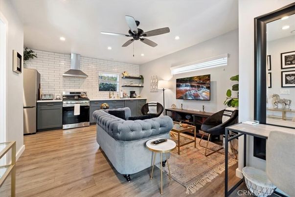 Interior, Kitchen, Living room, Recessed Lighting, Stainless Steel Appliances, Stone Walls, Wood Texture Flooring