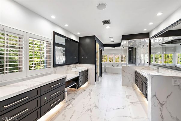Bathroom, Dual Sink Vanities, Glass Shower, Interior, Marble, Marble Walls, Recessed Lighting