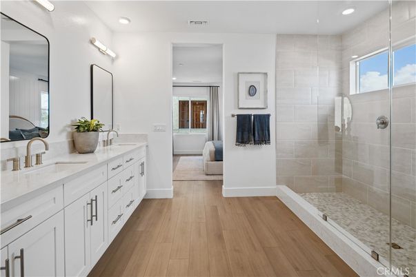 Bathroom, Dual Sink Vanities, Glass Shower, Interior, Recessed Lighting, Wood Texture Flooring