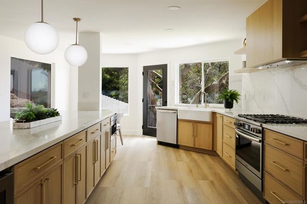 Interior, Kitchen, Marble Walls, Pendant Lights, Recessed Lighting, Stainless Steel Appliances, Wood Texture Flooring