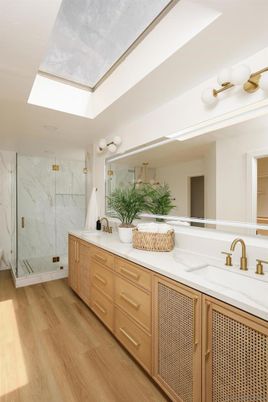 Bathroom, Dual Sink Vanities, Glass Shower, Interior, Marble Walls, Wood Texture Flooring
