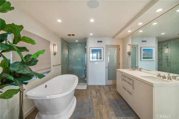 Bathroom, Dual Sink Vanities, Free Standing Baths, Glass Shower, Interior, Recessed Lighting, Wood Texture Flooring