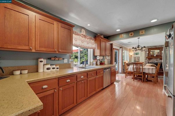 Chandelier, Dining room, Fireplace, Interior, Kitchen, Pendant Lights, Recessed Lighting, Stone Walls, Wood Texture Flooring