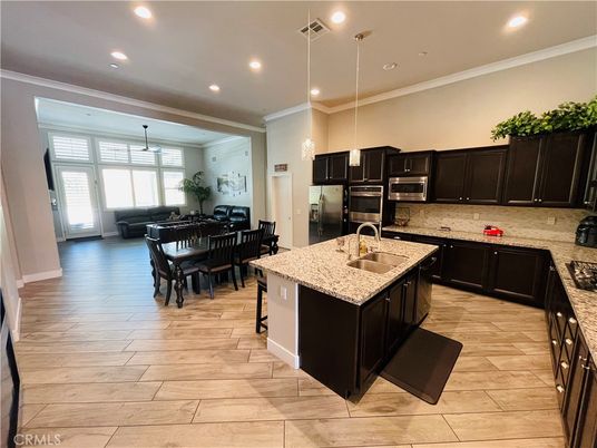 Dining room, Interior, Kitchen, Pendant Lights, Recessed Lighting, Stainless Steel Appliances, Wood Texture Flooring