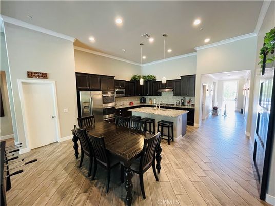 Dining room, Interior, Kitchen, Pendant Lights, Recessed Lighting, Stainless Steel Appliances, Wood Texture Flooring