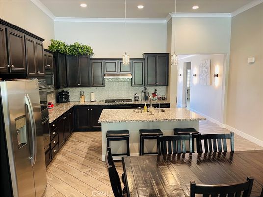 Dining room, Interior, Kitchen, Pendant Lights, Recessed Lighting, Stainless Steel Appliances, Wood Texture Flooring