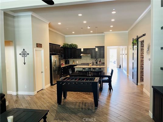 Dining room, Interior, Kitchen, Pendant Lights, Recessed Lighting, Stainless Steel Appliances, Wood Texture Flooring