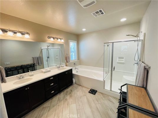 Bathroom, Dual Sink Vanities, Glass Shower, Interior, Recessed Lighting, Wood Texture Flooring