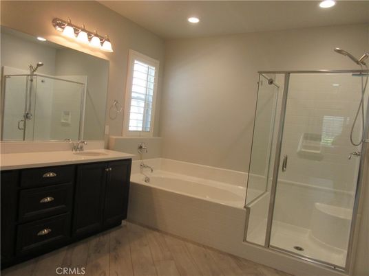 Bathroom, Dual Sink Vanities, Glass Shower, Interior, Recessed Lighting, Wood Texture Flooring