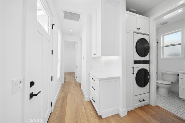 Bathroom, Interior, Recessed Lighting, Utility Closets, Washer, Wood Texture Flooring
