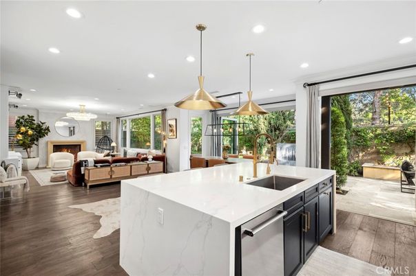 Fireplace, Interior, Kitchen, Living room, Pendant Lights, Recessed Lighting, Stainless Steel Appliances, Wood Texture Flooring
