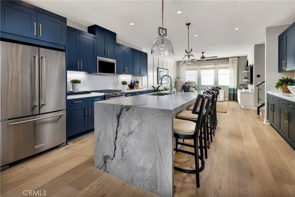 Interior, Kitchen, Marble Walls, Pendant Lights, Recessed Lighting, Stainless Steel Appliances, Wood Texture Flooring