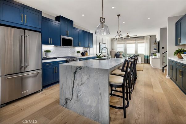 Interior, Kitchen, Marble Walls, Pendant Lights, Recessed Lighting, Stainless Steel Appliances, Wood Texture Flooring