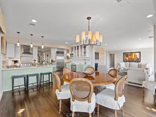 Dining room, Fireplace, Interior, Kitchen, Living room, Pendant Lights, Recessed Lighting, Stainless Steel Appliances, Wood Texture Flooring