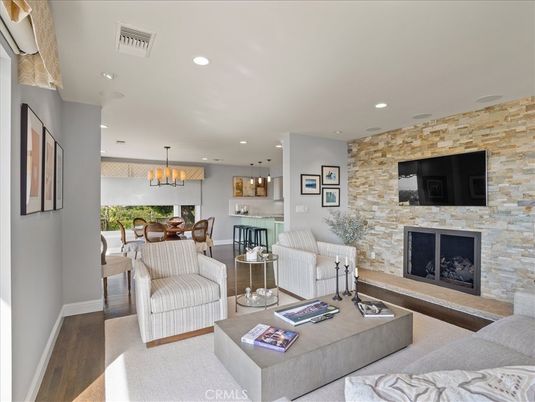 Chandelier, Dining room, Fireplace, Interior, Kitchen, Living room, Pendant Lights, Recessed Lighting, Stone Walls, Wood Texture Flooring