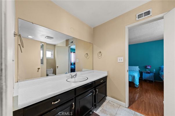 Bathroom, Bedroom, Dual Sink Vanities, Interior, Recessed Lighting, Wood Texture Flooring