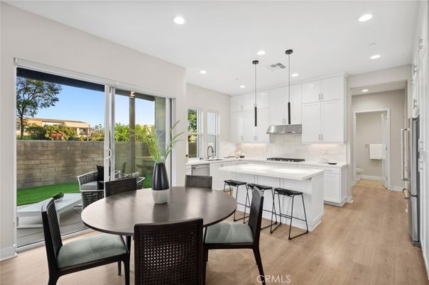 Dining room, Interior, Kitchen, Pendant Lights, Recessed Lighting, Stainless Steel Appliances, Wood Texture Flooring