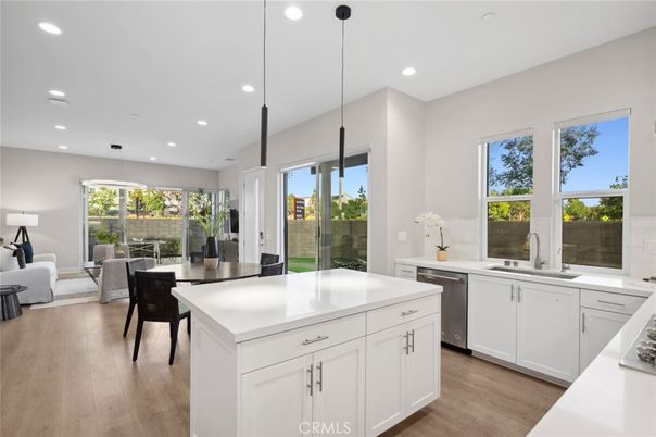 Dining room, Interior, Kitchen, Living room, Pendant Lights, Recessed Lighting, Stainless Steel Appliances, Wood Texture Flooring