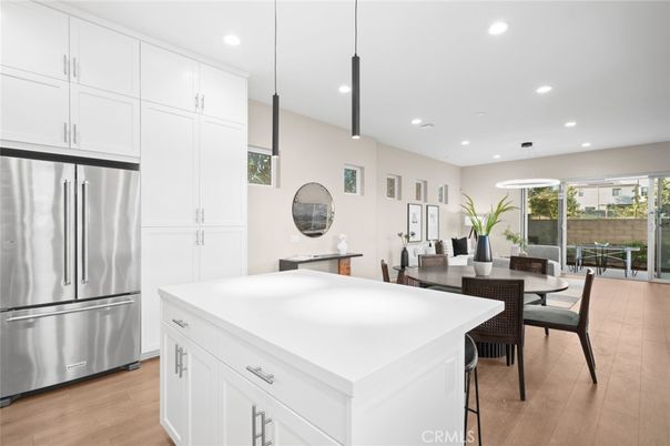 Dining room, Interior, Kitchen, Pendant Lights, Recessed Lighting, Stainless Steel Appliances, Wood Texture Flooring
