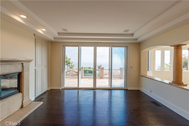 Empty room, Fireplace, Interior, Recessed Lighting, Water, Wood Texture Flooring