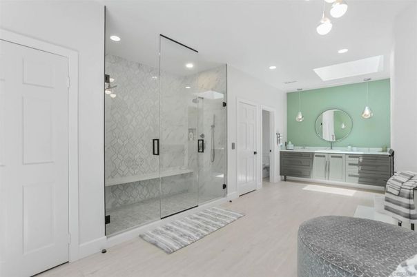 Bathroom, Glass Shower, Interior, Marble Walls, Pendant Lights, Recessed Lighting, Wood Texture Flooring