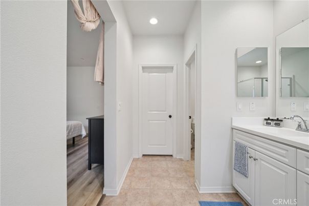 Bathroom, Bedroom, Dual Sink Vanities, Interior, Recessed Lighting, Wood Texture Flooring