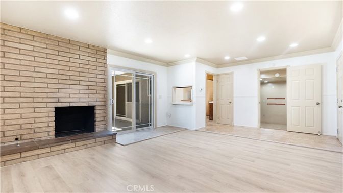 Empty room, Fireplace, Interior, Recessed Lighting, Stone Walls, Wood Texture Flooring