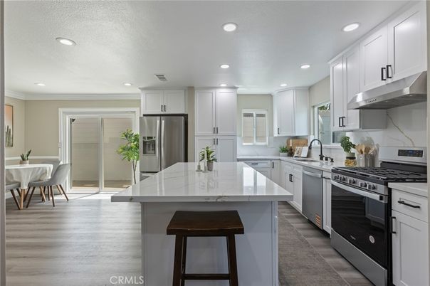 Dining room, Interior, Kitchen, Recessed Lighting, Stainless Steel Appliances, Wood Texture Flooring