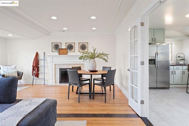 Dining room, Fireplace, Interior, Kitchen, Recessed Lighting, Stainless Steel Appliances, Wood Texture Flooring