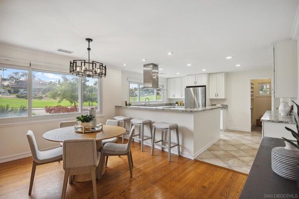 Chandelier, Dining room, Interior, Kitchen, Pendant Lights, Recessed Lighting, Stainless Steel Appliances, Wood Texture Flooring