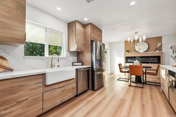 Dining room, Fireplace, Interior, Kitchen, Recessed Lighting, Stainless Steel Appliances, Wood Texture Flooring