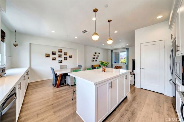 Dining room, Interior, Kitchen, Pendant Lights, Recessed Lighting, Stainless Steel Appliances, Wood Texture Flooring