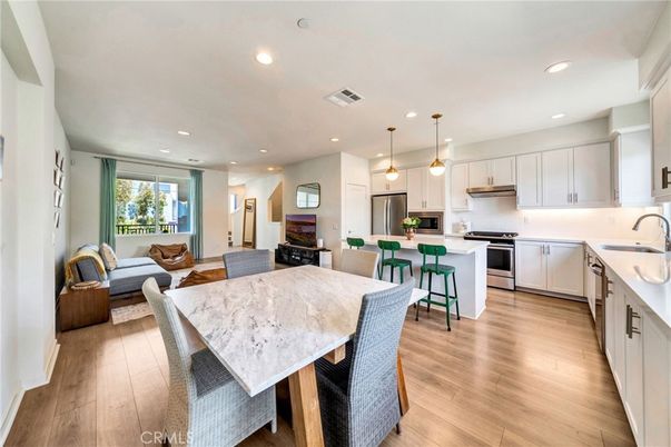 Dining room, Interior, Kitchen, Living room, Pendant Lights, Recessed Lighting, Stainless Steel Appliances, Wood Texture Flooring