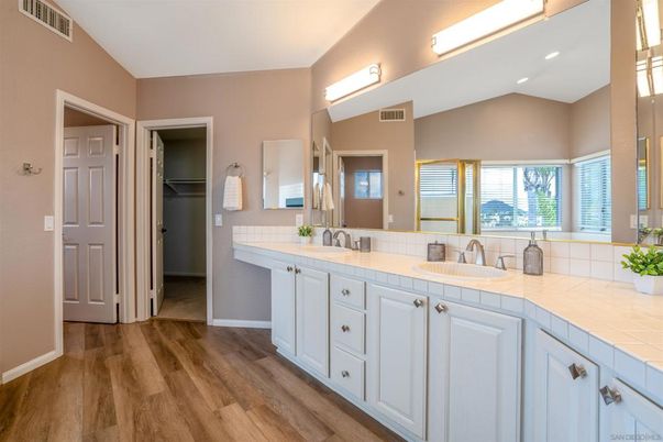 Bathroom, Dual Sink Vanities, Interior, Recessed Lighting, Tile Countertops, Wood Texture Flooring