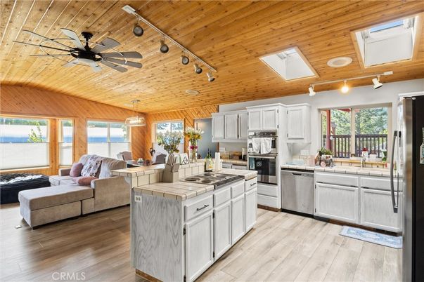 Interior, Kitchen, Living room, Pendant Lights, Stainless Steel Appliances, Tile Countertops, Wooden Ceilings, Wood Texture Flooring, Wooden Walls