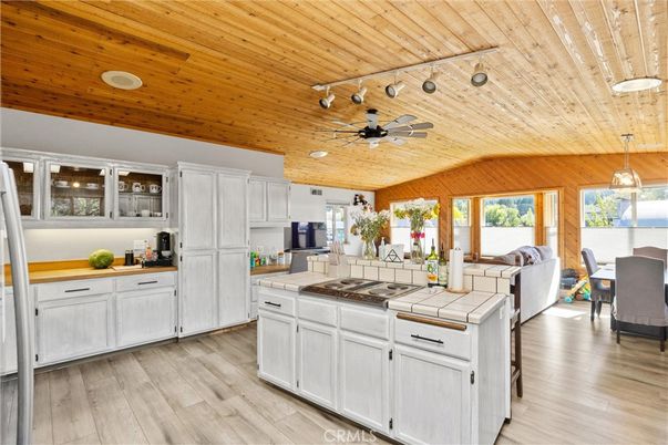 Dining room, Interior, Kitchen, Living room, Pendant Lights, Recessed Lighting, Tile Countertops, Wooden Ceilings, Wood Texture Flooring