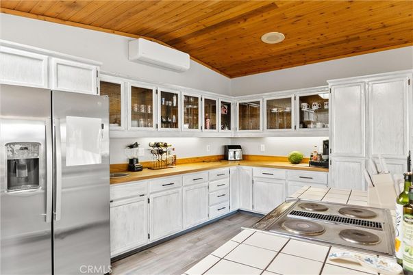 Interior, Kitchen, Tile Countertops, Wooden Ceilings, Wood Texture Flooring