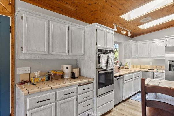 Interior, Kitchen, Stainless Steel Appliances, Tile Countertops, Wooden Ceilings, Wood Texture Flooring