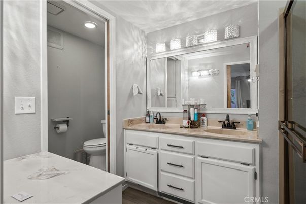 Bathroom, Dual Sink Vanities, Interior, Recessed Lighting, Wood Texture Flooring