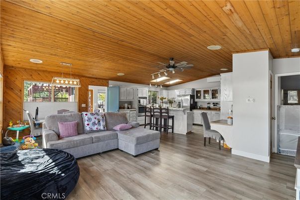 Dining room, Interior, Kitchen, Living room, Pendant Lights, Recessed Lighting, Stainless Steel Appliances, Wooden Ceilings, Wood Texture Flooring, Wooden Walls