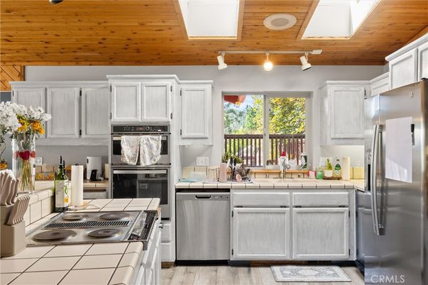 Interior, Kitchen, Stainless Steel Appliances, Tile Countertops, Wooden Ceilings, Wood Texture Flooring