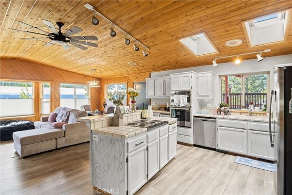 Interior, Kitchen, Living room, Pendant Lights, Stainless Steel Appliances, Tile Countertops, Wooden Ceilings, Wood Texture Flooring, Wooden Walls
