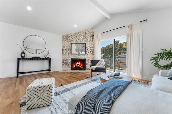 Bedroom, Fireplace, Interior, Living room, Recessed Lighting, Stone Walls, Wood Texture Flooring