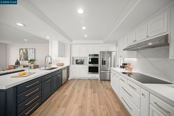 Interior, Kitchen, Marble Walls, Recessed Lighting, Stainless Steel Appliances, Wood Texture Flooring