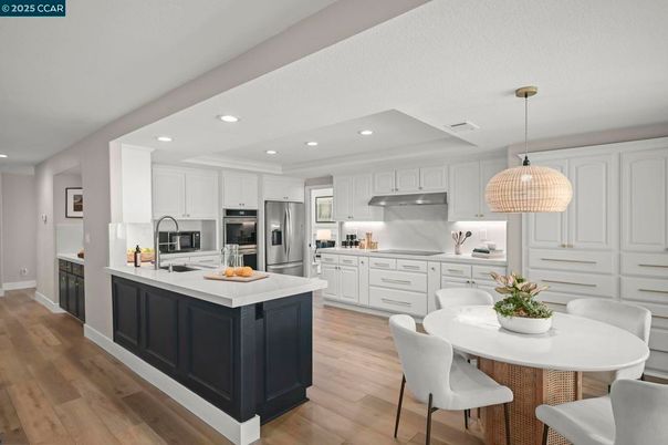 Dining room, Interior, Kitchen, Pendant Lights, Recessed Lighting, Stainless Steel Appliances, Wood Texture Flooring