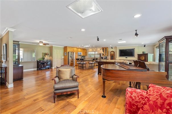 Dining room, Interior, Kitchen, Pendant Lights, Piano, Recessed Lighting, Stainless Steel Appliances, Wood Texture Flooring