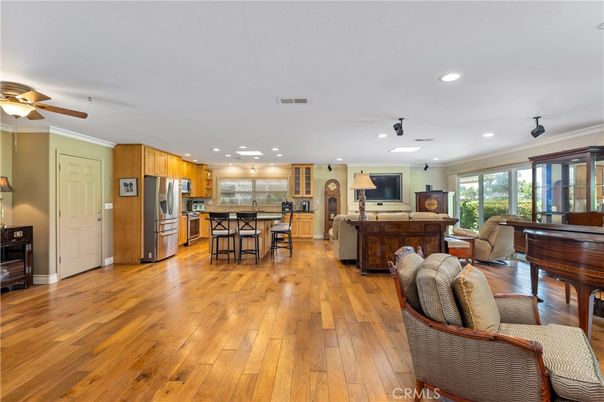 Dining room, Interior, Kitchen, Living room, Piano, Recessed Lighting, Stainless Steel Appliances, Wood Texture Flooring