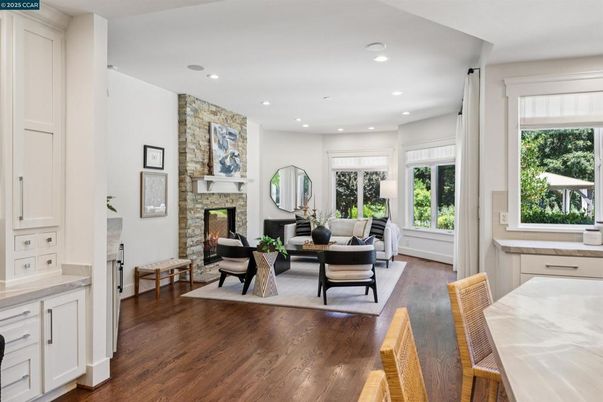 Dining room, Fireplace, Interior, Living room, Recessed Lighting, Stone Walls, Wood Texture Flooring