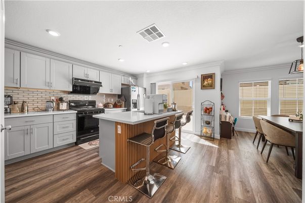 Dining room, Interior, Kitchen, Recessed Lighting, Stainless Steel Appliances, Wood Texture Flooring