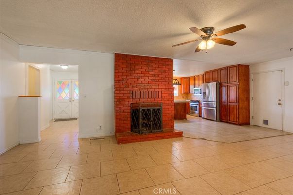Empty room, Fireplace, Interior, Kitchen, Stainless Steel Appliances, Stone Walls